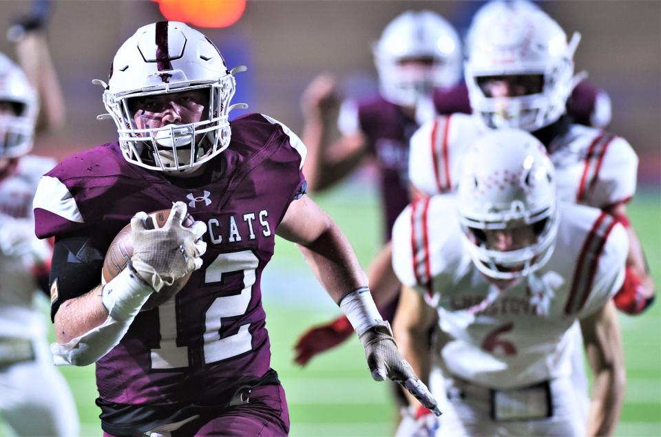Hawley running back Austin Cumpton runs for his second of three touchdowns against Christoval. The 25-yard scoring run helped the Bearcats take a 30-0 lead with 44 seconds left in the first quarter. Hawley won the Region I-2A Division I bi-district playoff game 52-8 on Nov. 10 at San Angelo Stadium.