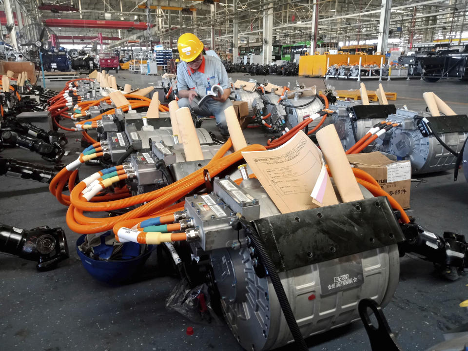 In this Aug. 29, 2018, photo, a man works in an auto parts factory in Liaocheng in eastern China's Shandong province. The Trump administration announced Monday, Sept. 17, 2018, that it will impose tariffs on $200 billion more in Chinese goods starting next week, escalating a trade war between the world's two biggest economies and potentially raising prices on goods ranging from handbags to bicycle tires. (Chinatopix via AP)