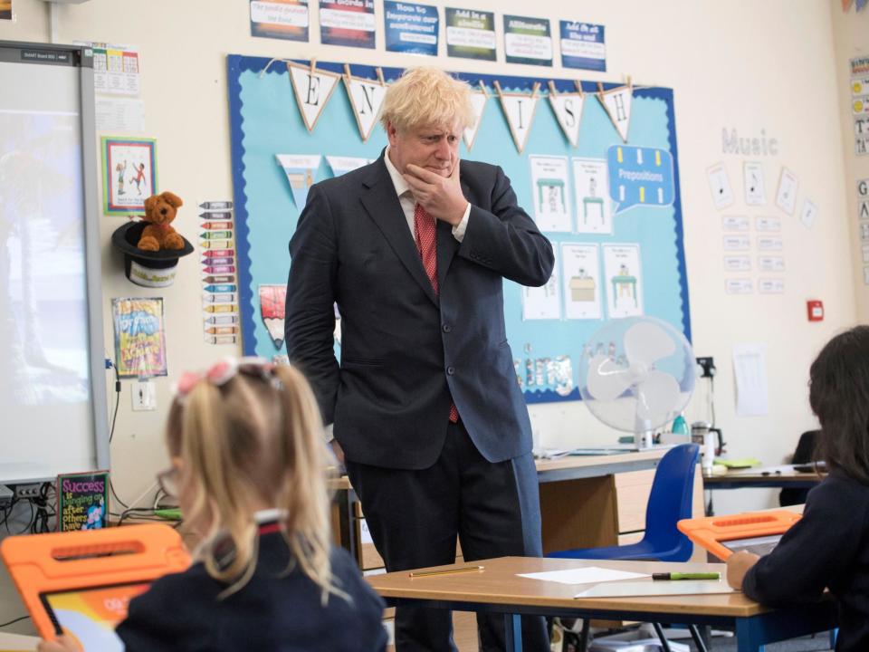 Boris Johnson reacts during a visit to The Discovery School, Kent in July. The PM has urged for schools to fully reopen by September: Reuters