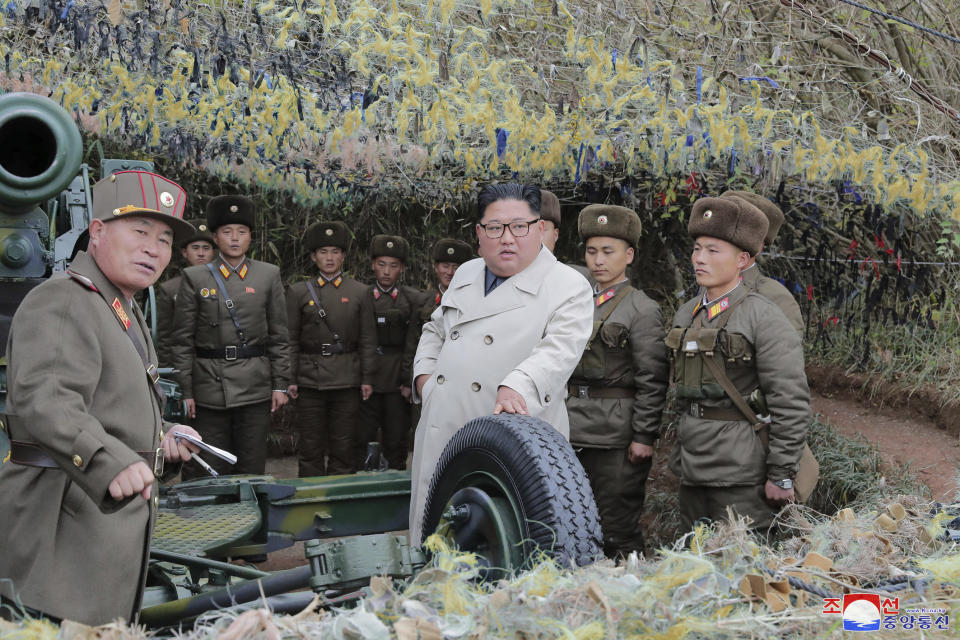 In this undated photo provided on Monday, Nov. 25, 2019, by the North Korean government, North Korean leader Kim Jong Un, center, inspects a military unit on Changrin Islet in North Korea. Independent journalists were not given access to cover the event depicted in this image distributed by the North Korean government. The content of this image is as provided and cannot be independently verified. Korean language watermark on image as provided by source reads: "KCNA" which is the abbreviation for Korean Central News Agency. (Korean Central News Agency/Korea News Service via AP)