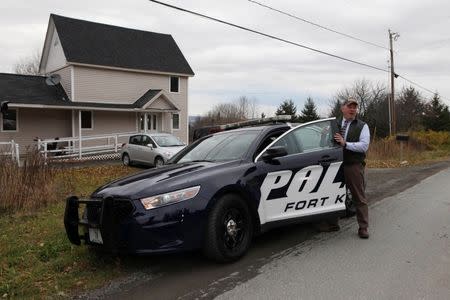 Fort Kent Police Chief Thomas Pelletier gets into his car after a brief visit to the home where Kaci Hickox, the American nurse who treated Ebola patients in Sierra Leone, is staying in Fort Kent, Maine October 31, 2014. REUTERS/Joel Page