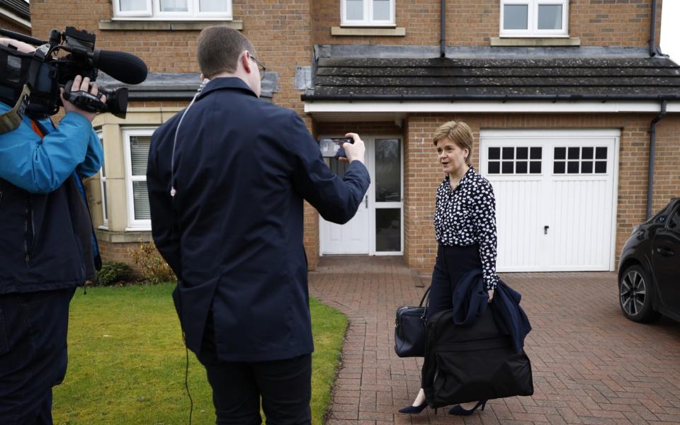 Nicola Sturgeon speaks to reporters outside her home following the resignation of Mr Murrell as SNP chief executive - Jeff J Mitchell/Getty Images