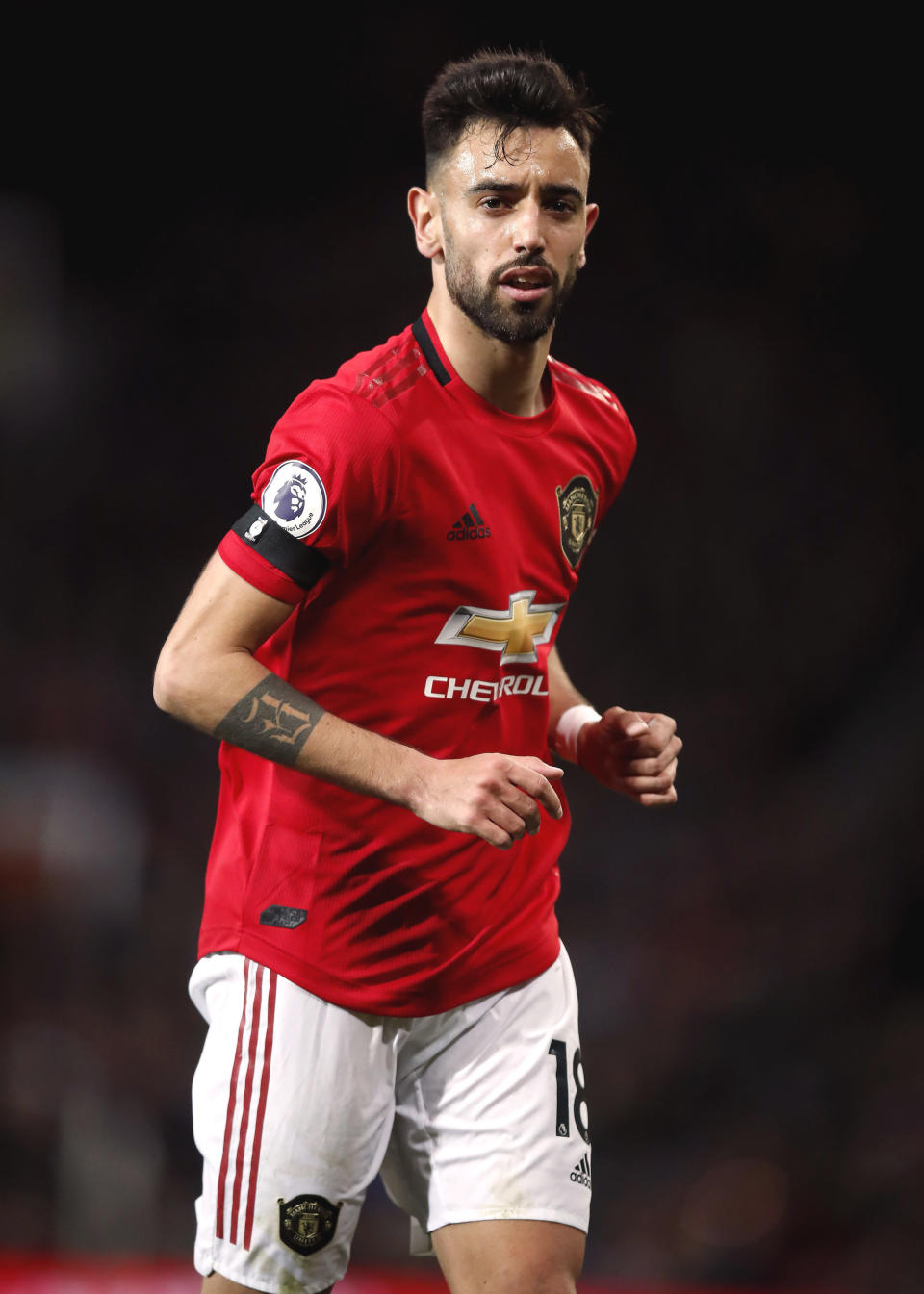 Manchester United's Bruno Fernandes runs, during the English Premier League soccer match between Manchester United and Wolverhampton Wanderers, at Old Trafford, in Manchester, England, Saturday, Feb. 1, 2020. (Martin Rickett/PA via AP)