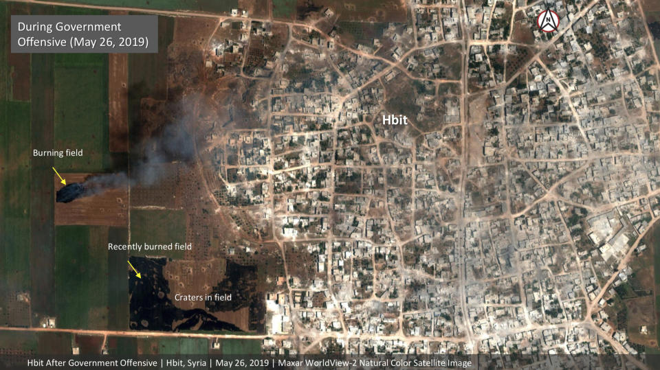 This satellite image provided by Maxar Technologies on Tuesday, May 28, 2019 shows significant damage to Habeet, Syria on May 26 as a result of a government offensive against the last rebel stronghold in the country. The images, provided to the Associated Press by the Colorado-based Maxar Technologies show fire still raging in olive groves and orchards during harvest season around Kfar Nabudah and Habeet, two villages on the edge of Idlib province where fighting has focused. (Maxar Technologies via AP)