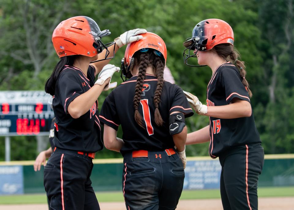 Pennbury's Jane Lloyd, left, and Rowan Mulhollland celebrate a three-run homer by Ava Storlazzi (1) in a PIAA quarterfinal softball game at Messiah University in Mechanicsburg on Thursday, June 9, 2022. The Falcons defeated the Tigers, 10-2, to advance to the semifinals.