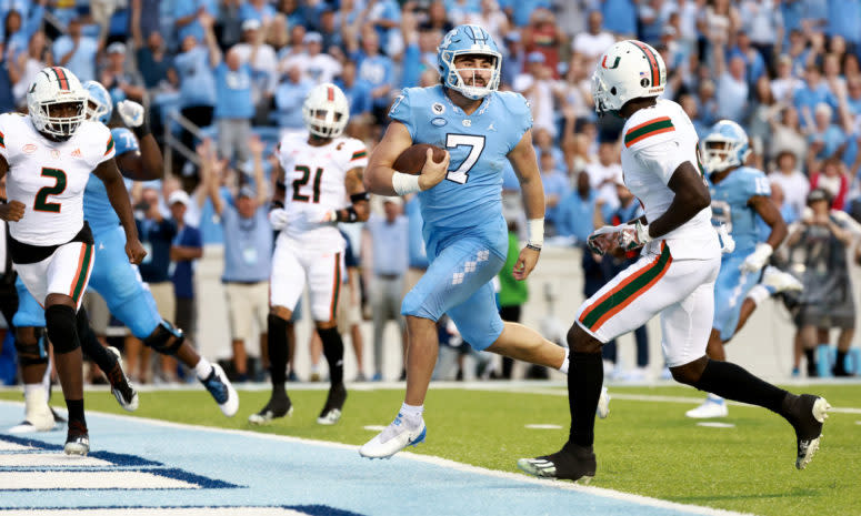 North Carolina Tar Heels quarterback Sam Howell runs in a touchdown against Miami.