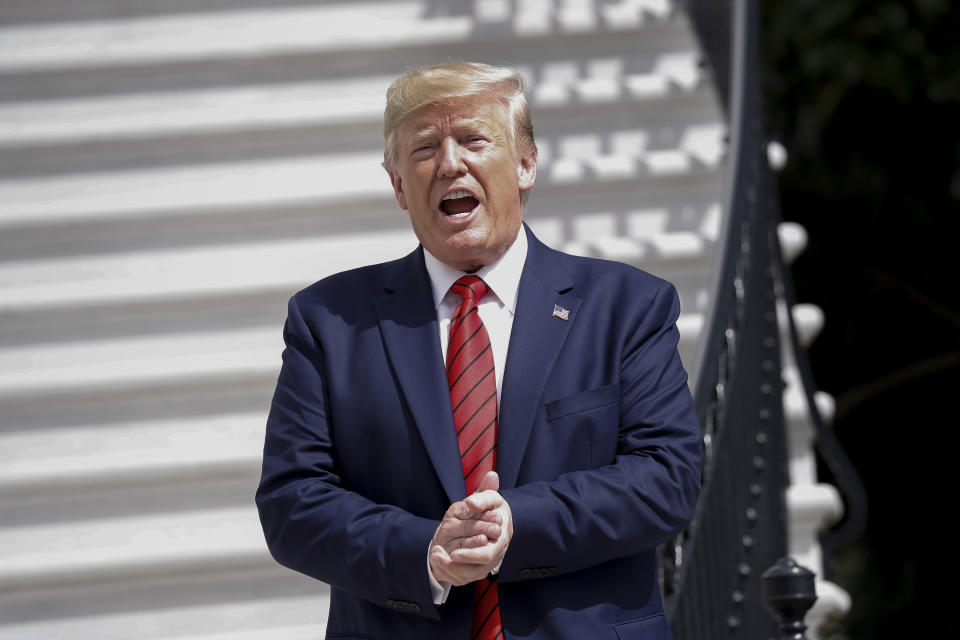 President Donald Trump gestures towards members on the media on the South Lawn of the White House in Washington, Thursday, Sept. 26, 2019, after returning from United Nations General Assembly. (AP Photo/Pablo Martinez Monsivais)