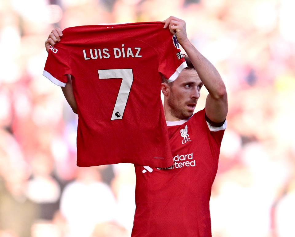 LIVERPOOL, ENGLAND - OCTOBER 29: (THE SUN OUT, THE SUN ON SUNDAY OUT) Diogo Jota of Liverpool celebrates after scoring the opening goal by holding a Luis Diaz shirt during the Premier League match between Liverpool FC and Nottingham Forest at Anfield on October 29, 2023 in Liverpool, England. (Photo by Andrew Powell/Liverpool FC via Getty Images)