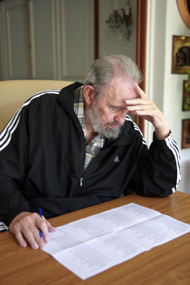 Castro studying his ballot to elect Cuba's new Communist Party Central Committee at his home in Havana, Cuba, Monday April 18, 2011. (AP Photo/Alex Castro)