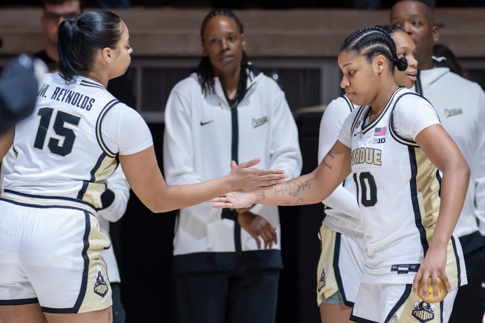 Purdue Boilermakers guard Jeanae Terry (10) and Purdue Boilermakers forward Mila Reynolds (15) exchange and shakes during starting line-ups of the NCAA women’s basketball game against the Penn State Nittany Lions, Wednesday Feb. 28, 2024, at Mackey Arena in West Lafayette, Ind. Penn State won 93-88.