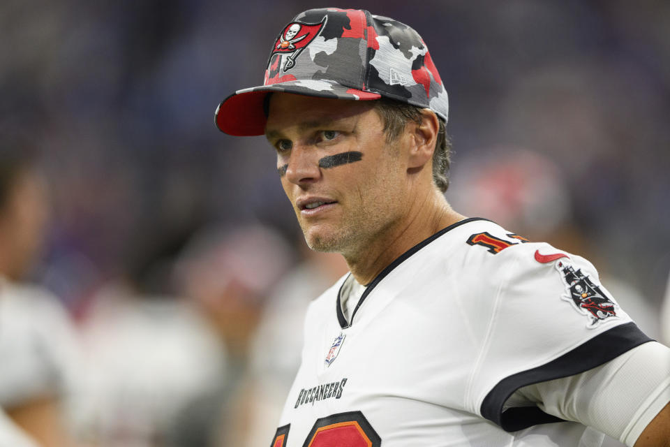 FILE - Tampa Bay Buccaneers quarterback Tom Brady (12) stands on the sideline during an NFL football game against the Indianapolis Colts, Aug. 27, 2022, in Indianapolis. A New Jersey man who posed as a former New England Patriots player in order to buy and sell Super Bowl rings that he claimed were gifts to Brady's family has been sentenced to three years in federal prison. (AP Photo/Zach Bolinger, File)