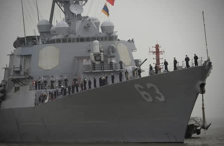 U.S. navy sailors stand in formation on the deck as USS Stethem (DDG 63) destroyer vessel arrives at a military port for an official visit, in Shanghai, China, November 16, 2015. REUTERS/Stringer