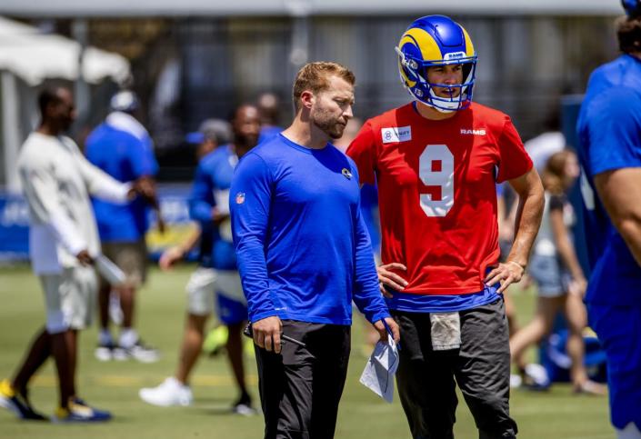 Rams coach Sean McVay speaks with quarterback Matthew Stafford at training camp on Sunday.