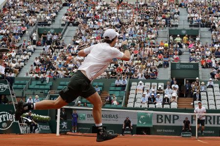 Tennis - French Open - Roland Garros - Ivo Karlovic of Croatia v Andy Murray of Britain - Paris, France - 27/05/16. Murray returns a shot. REUTERS/Jacky Naegelen