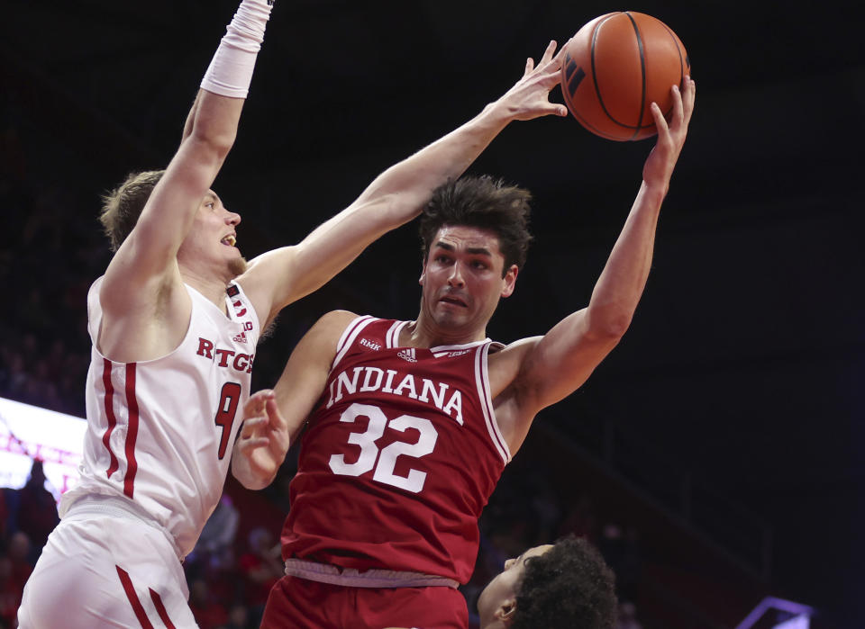 Rutgers forward Oskar Palmquist (9) defends a shot by Indiana guard Trey Galloway (32) during the first half of an NCAA college basketball game, Tuesday, Jan. 9, 2024 in Piscataway, N.J. (Andrew Mills/NJ Advance Media via AP)