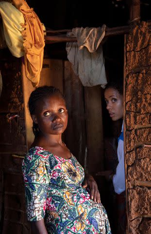 <p>UNHCR/Caroline Irby</p> UNHCR Goodwill Ambassador Gugu Mbatha-Raw with Maliyetu Shamavu, known as Cadette, 25, pregnant with her seventh child, at home in a transitional settlement site.