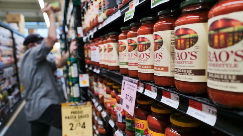 Jars of pasta sauce on shelves