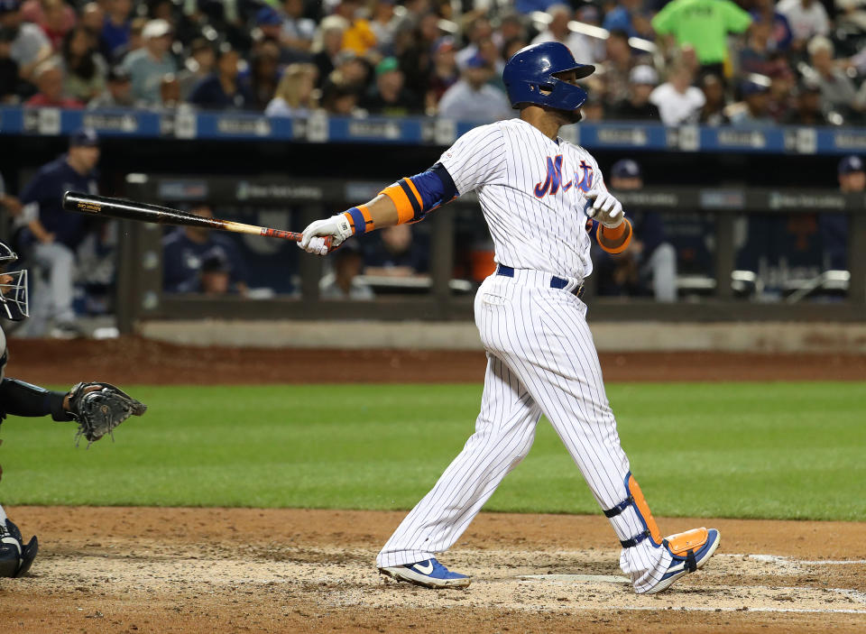 NEW YORK, NEW YORK - JULY 23:  Robinson Cano #24 of the New York Mets hits a sixth inning home run against the San Diego Padres during their game at Citi Field on July 23, 2019 in New York City. (Photo by Al Bello/Getty Images)