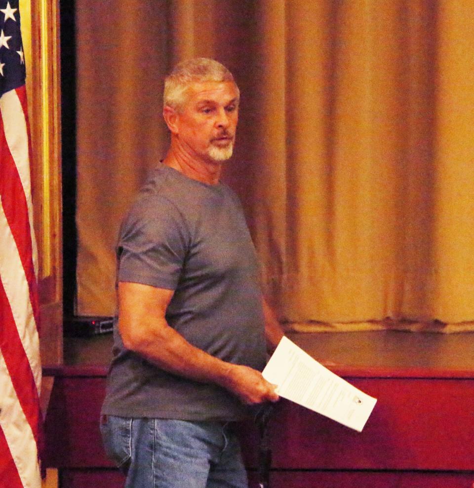 Pontiac city employee Rick Rambo discusses a new wheelchair lift for the Eagle Theater and where it will be placed at Monday's city council meeting.