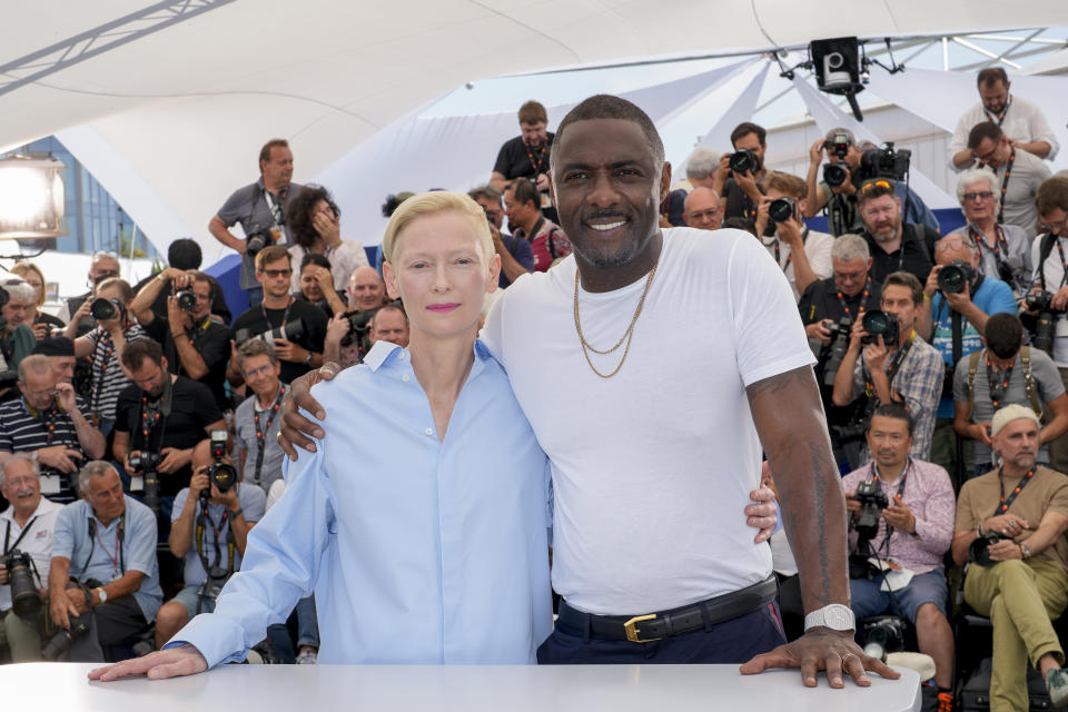 FILE - Tilda Swinton, left, and Idris Elba pose for photographers at the photo call for the film 'Three Thousand Years of Longing' at the 75th international film festival, Cannes, southern France, Saturday, May 21, 2022. Star power has been out in force at the 75th Cannes Film Festival. After a 2021 edition muted by the pandemic, this year's French Riviera spectacular has again seen throngs of onlookers screaming out "Tom!" "Julia!" and "Viola!" The wattage on display on Cannes' red carpet has been brighter this year thanks the presence of stars like Tom Cruise, Julia Roberts, Viola Davis, Anne Hathaway, Idris Elba and others. But as the first half of the French Riviera spectacular has shown, stardom in Cannes is global. Just as much as cameras have focused on Hollywood stars, they've been trained on the likes of India's Aishwarya Rai and South Korea's Lee Jung-jae. (AP Photo/Petros Giannakouris, File)