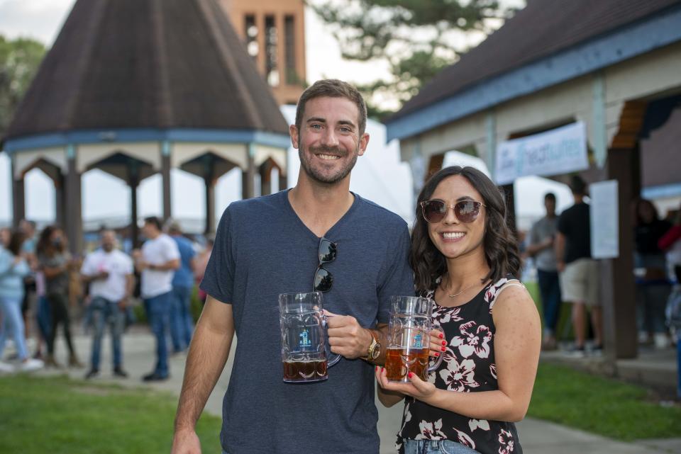 Covington Oktoberfest returns to Goebel Park Sept. 8-10. The fest will have plenty of beer, food, music and German culture. Pictured: Adam Waring of Fort Wright and Kat of Cincinnati with mugs of Braxton beer.