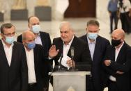 Head of Hezbollah's parliamentary bloc Mohamed Raad gestures as he speaks at the presidential palace in Baabda