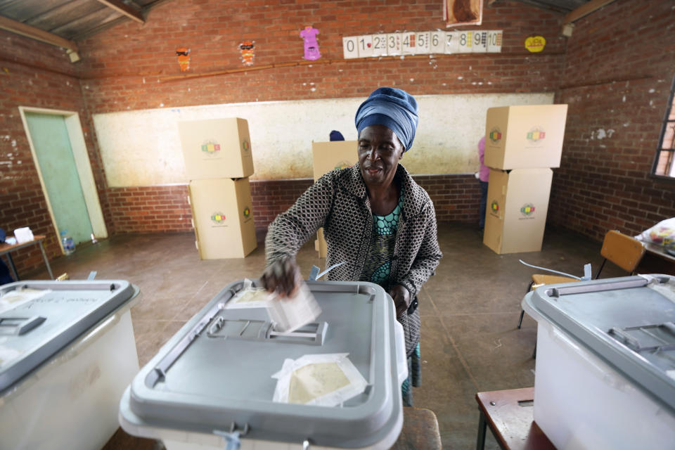 A woman casts her vote at a polling station in Harare, Zimbabwe, Wednesday, Aug. 23, 2023. Polls have opened in Zimbabwe as President President Emmerson Mnangagwa seeks a second and final term in a country with a history of violent and disputed votes. (AP Photo/Tsvangirayi Mukwazhi)