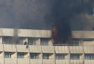 <p>A man tries to escape from a balcony at Kabul’s Intercontinental Hotel during an attack by gunmen in Kabul, Afghanistan January 21, 2018. (Photo: Omar Sobhani/Reuters) </p>