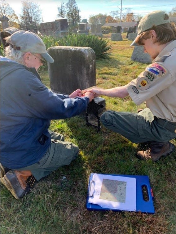 Benjamin Bouffard, a member of Swansea Boy Scout Troop 303, recently completed his Eagle Scout project, placing markers on the graves of Civil War veterans in town. Pictured are Robert Bouffard and Benjamin Bouffard.