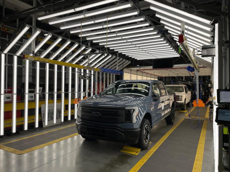 A completed F-150 Lightning reaches the end of the assembly line at Ford's Rouge Electric Vehicle Center.