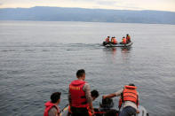Rescue team members conduct search operations for missing passengers from a ferry accident at Lake Toba, at Tigaras port in Simalungun, North Sumatra, Indonesia June 21, 2018. REUTERS/Beawiharta