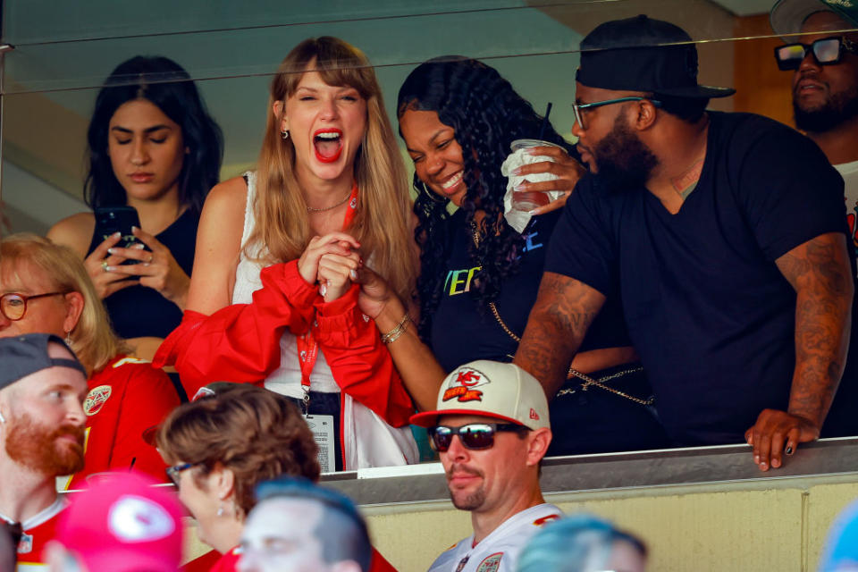 taylor cheering at travis' football game