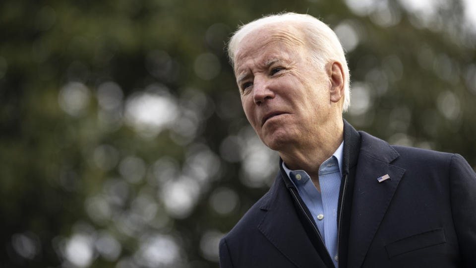 President Biden talks to reporters on the South Lawn of the White House.