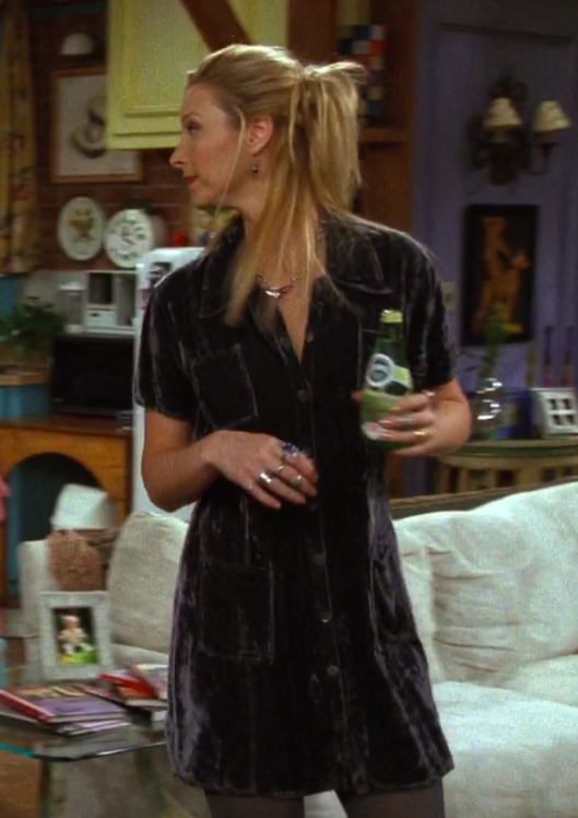 Phoebe wearing a shirt dress, tights, and ugly shoes