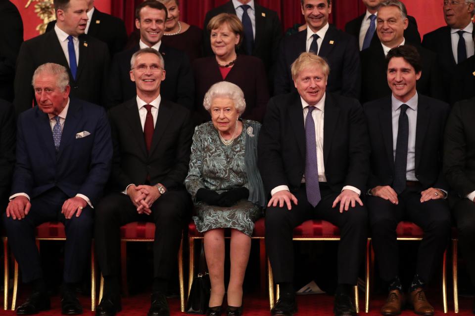 front row (L-R) Britain's Prince Charles, Prince of Wales, NATO Secretary General Jens Stoltenberg, Britain's Queen Elizabeth II, Britain's Prime Minister Boris Johnson and Canada's Prime Minister Justin Trudeau sit together at Buckingham Palace in central London on December 3, 2019, as leaders of Nato alliance countries, and its secretary general, join Queen Elizabeth II and the Prince of Wales for a group picture to mark 70 years of the alliance ahead of the NATO alliance summit. - NATO leaders gather Tuesday for a summit to mark the alliance's 70th anniversary but with leaders feuding and name-calling over money and strategy, the mood is far from festive. (Photo by Yui Mok / POOL / AFP) (Photo by YUI MOK/POOL/AFP via Getty Images)