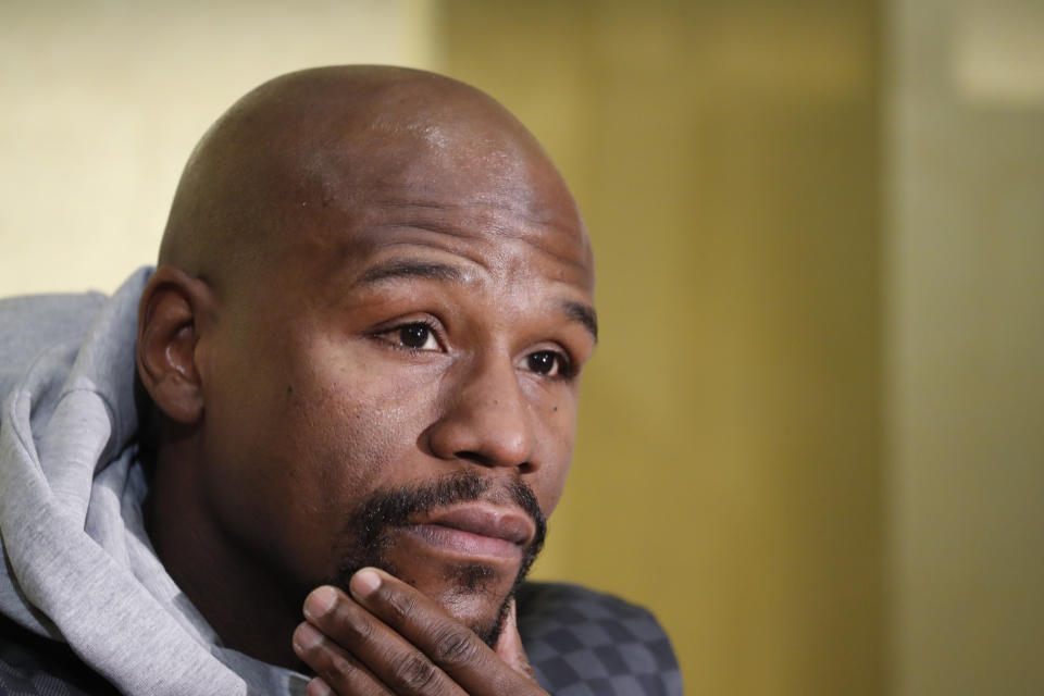 Floyd Mayweather Jr. listens questions from media during a news conference in Tokyo Saturday, Dec. 29, 2018. Mayweather is scheduled to fight Japanese kickboxer Tenshin Nasukawa in a three-round exhibition match in Japan on New Year's Eve. (AP Photo/Eugene Hoshiko)