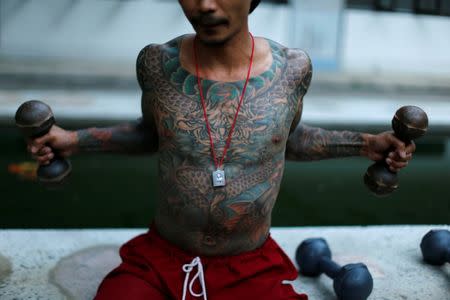 A patient works out at the rehabilitation and detox area at Wat Thamkrabok monastery in Saraburi province, Thailand, February 7, 2017. REUTERS/Jorge Silva