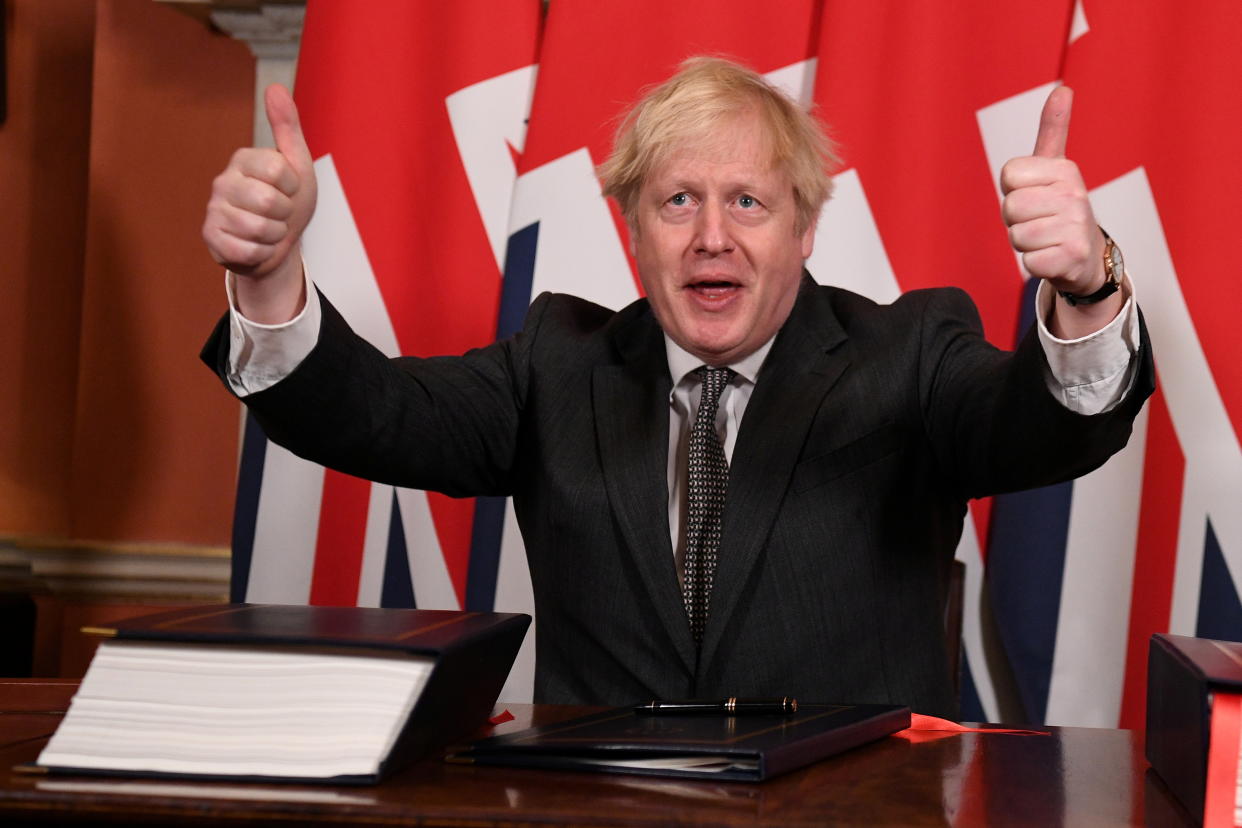 Britain's Prime Minister Boris Johnson gives a thumbs up after signing the Brexit trade deal with the EU at number 10 Downing Street in London, Britain December 30, 2020. Leon Neal/Pool via REUTERS     TPX IMAGES OF THE DAY