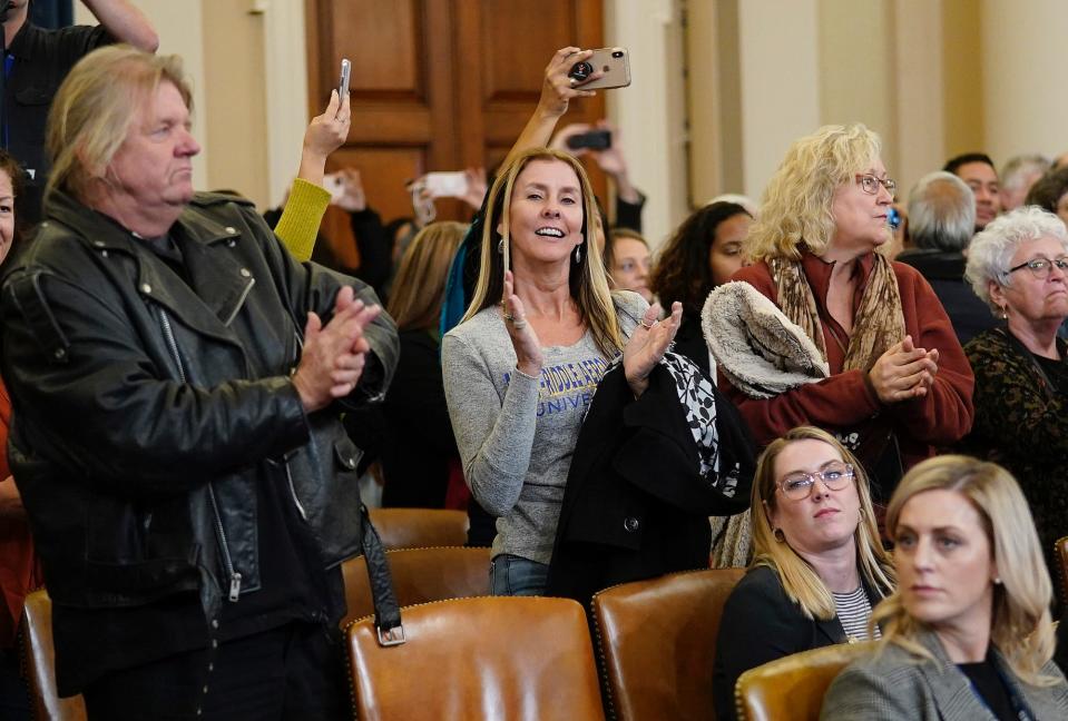 Members of the public in the audience applaud as former U.S. Ambassador to Ukraine Marie Yovanovitch concludes her testimony before the House Intelligence Committee in the Longworth House Office Building on Capitol Hill November 15, 2019