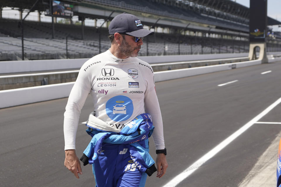 Jimmie Johnson walks down pit lane during practice for the Indianapolis 500 auto race at Indianapolis Motor Speedway, Tuesday, May 17, 2022, in Indianapolis. (AP Photo/Darron Cummings)