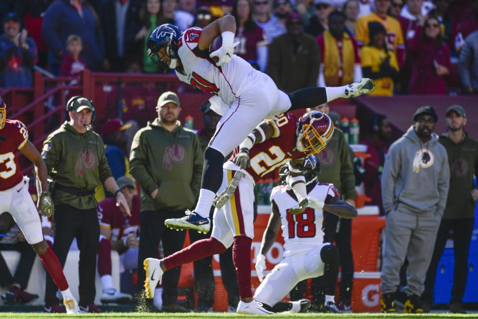 <p>Atlanta Falcons tight end Austin Hooper (81) leaps over Washington Redskins free safety Ha Ha Clinton-Dix (20) during the first half of an NFL football game between the Atlanta Falcons and the Washington Redskins, Sunday, Nov. 4, 2018 in Landover, Md. (AP Photo/Susan Walsh) </p>
