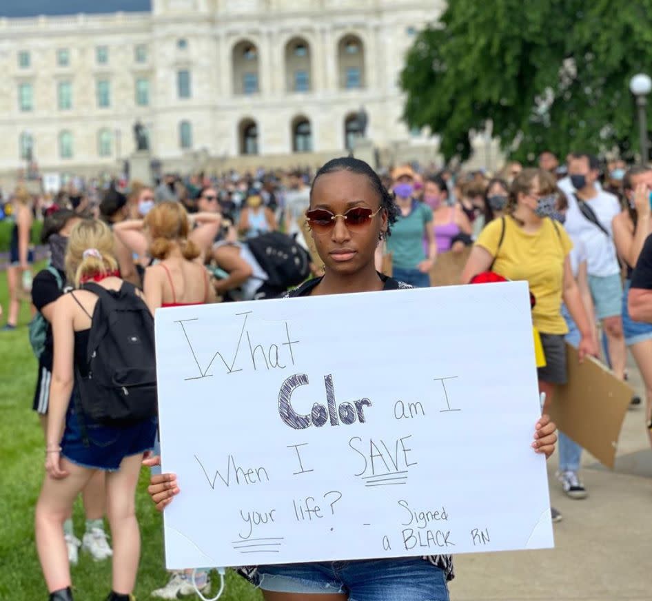 <i>Courtney, a nurse, attends a sit-in protest in Saint Paul, Minnesota, on June 2. (She was wearing a mask but removed it for the photo, she said). The sign reads: "What color am I when I save your life? Signed, a Black R.N."</i>