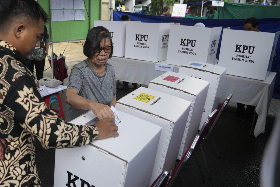 FILE - A woman casts her ballot at a polling station during the election in Jakarta, Indonesia, Wednesday, Feb. 14, 2024. The camps of the two presidential candidates who appear to have lost in Indonesia's election last month said Thursday they plan to challenge the results in the Constitutional Court with allegations of widespread fraud. (AP Photo/Dita Alangkara, File)