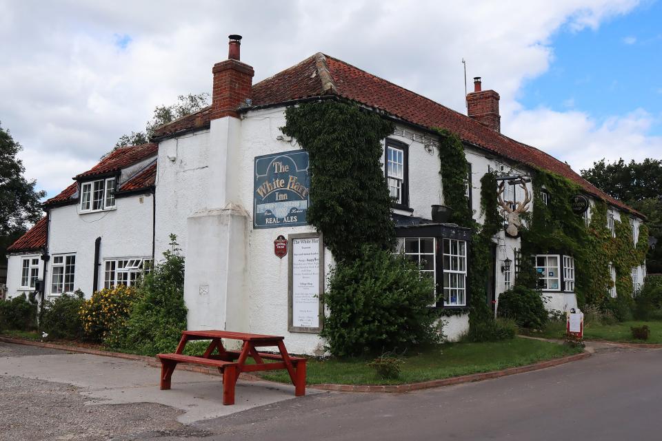 Outside of a 16th century pub available for rent on Airbnb