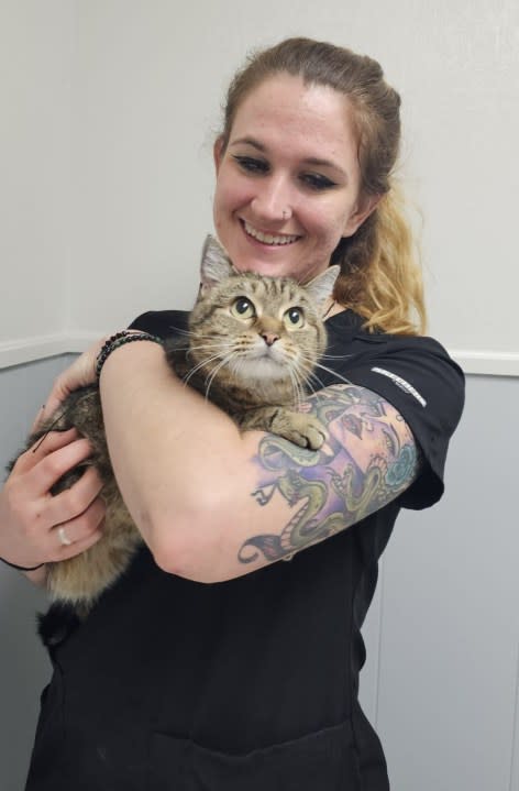 Gracie the cat pictured with KPA’s rescue coordinator. (Image/Kerrville Pets Alive)