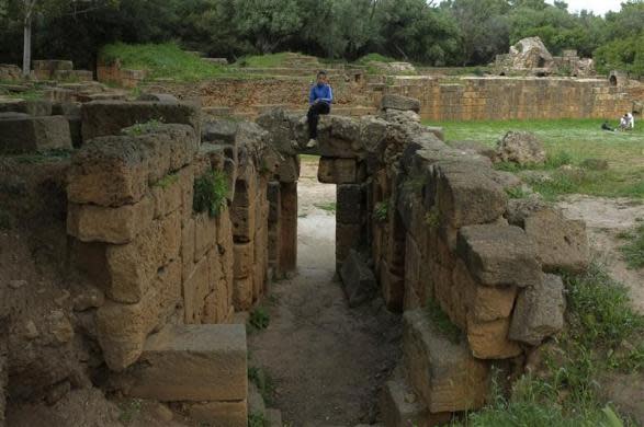 A boy sits on a Roman vestige at the Tipasa archaeological UNESCO World Heritage site, some 70 km (43 miles) west of Algiers, May 4, 2012.