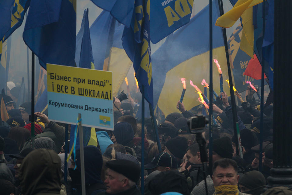 <p>Members of nationalist groups light flares during a rally to mark the third anniversary of the Maidan protests at the Ukrainian Parliament. Three Ukrainian far right organizations Azov, Svoboda and Right Sector gather about 10 thousands of its members and supporters for a “March of National Dignity” downtown Kiev, Ukraine on Feb. 22, 2017. (Sergii Kharchenko/NurPhoto via Getty Images) </p>