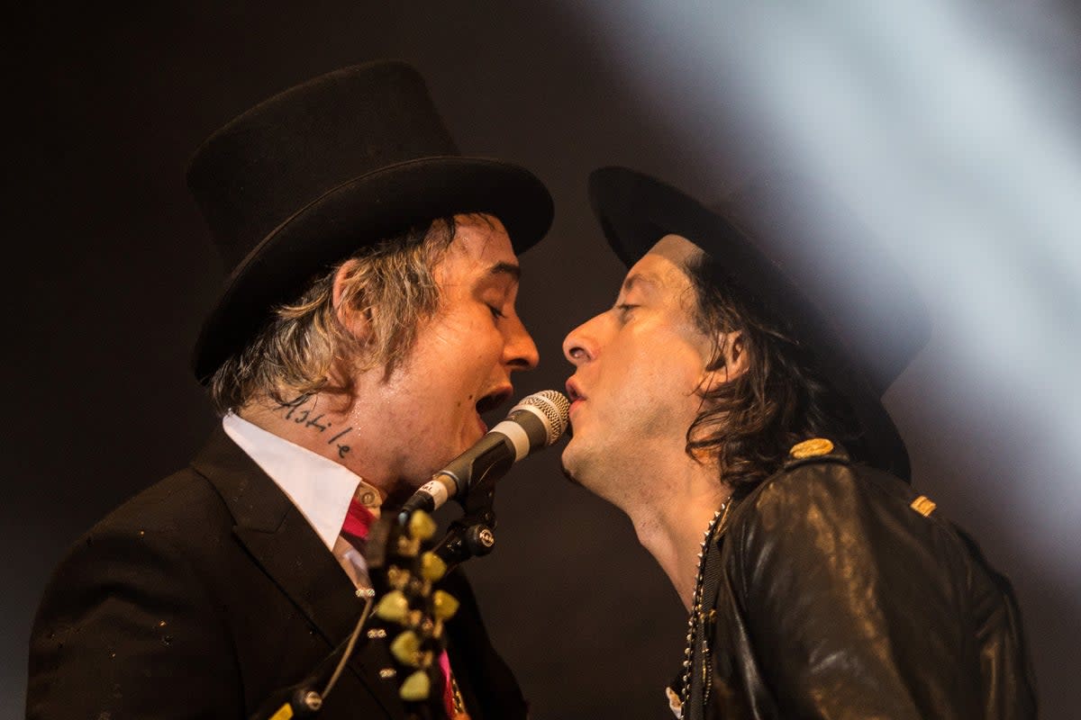 Pete Doherty and Carl Barat perform with their band The Libertines in 2015 (AFP via Getty Images)