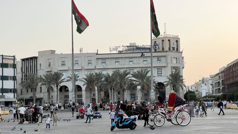 FILE PHOTO: People walk in Martyrs' Square, Tripoli