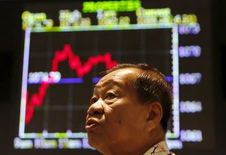 An investor monitors share market prices in Kuala Lumpur, Malaysia, August 25, 2015. REUTERS/Olivia Harris/Files